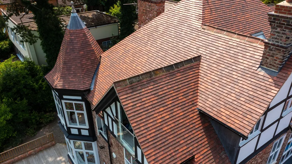 The Gables - Plain Tile - Rosemary Clay Classic Medium Mixed Brindle roof tile on period roof with turret, hips, valleys, ridges