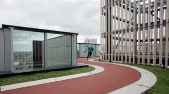Find out more about roofing topics and information. White Collar Development with BMI Icopal flat roof running track. 